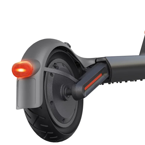 Close-up of an electric scooter wheel with a red light on a white background