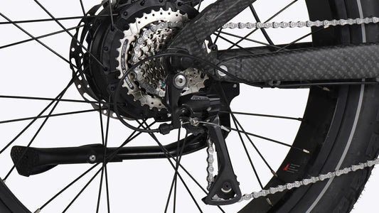 Close-up of a bicycle's gear system with chain and sprockets on a white background