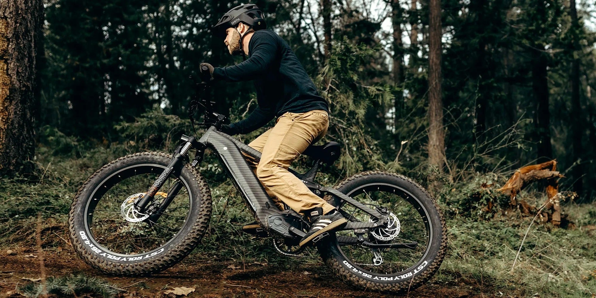 Person riding a electric bike in a forest setting