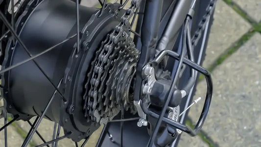 Close-up of a bicycle gear system with a blurred background