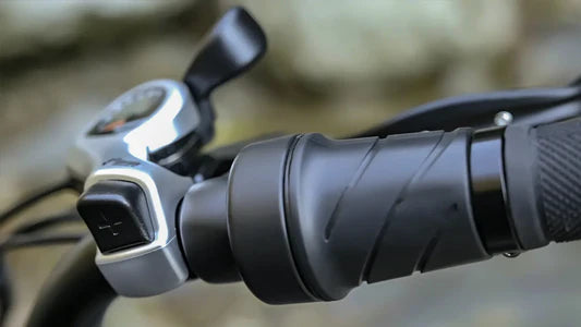 Close-up of motorcycle handlebar with throttle and grips